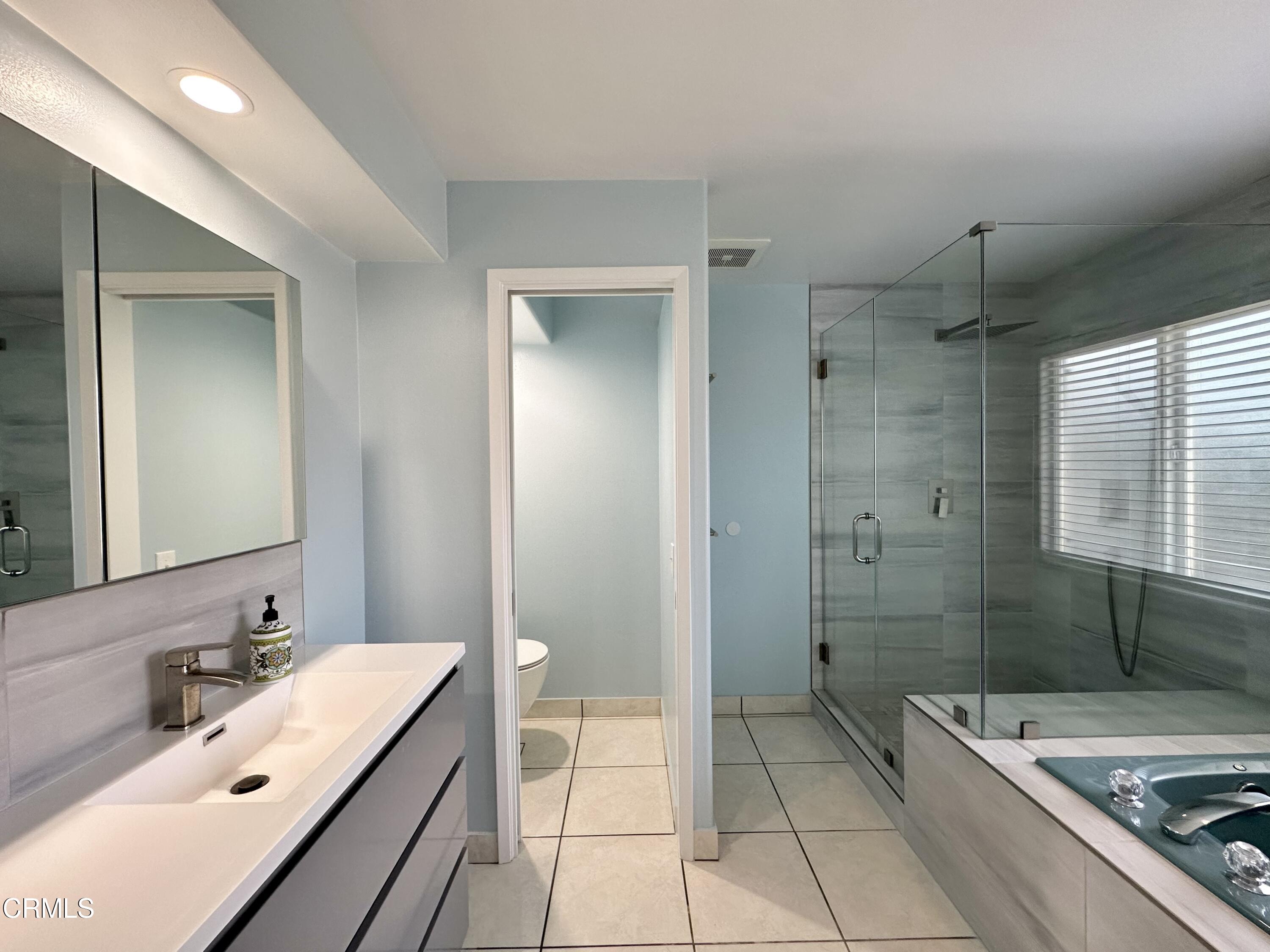 4053 Sunset Lane Oxnard, CA 93035 - Photo 18 of 34 a bathroom with a sink a toilet and shower