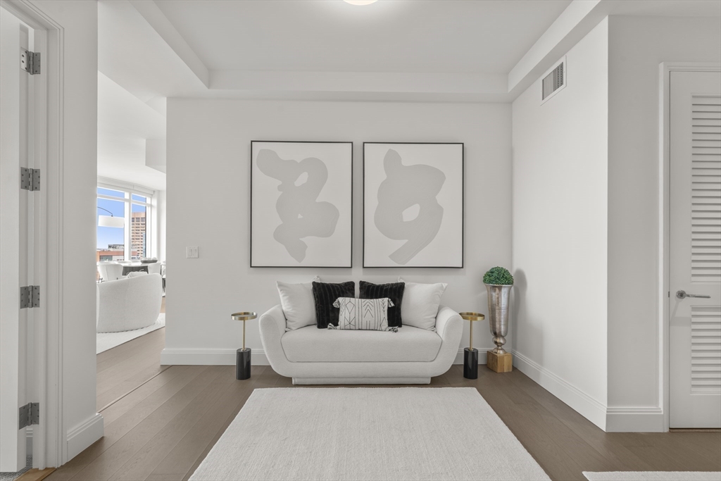 240 Devonshire Street, Unit 3701 Boston, MA 02110 - Photo 11 of 40 a living room with furniture and a gate