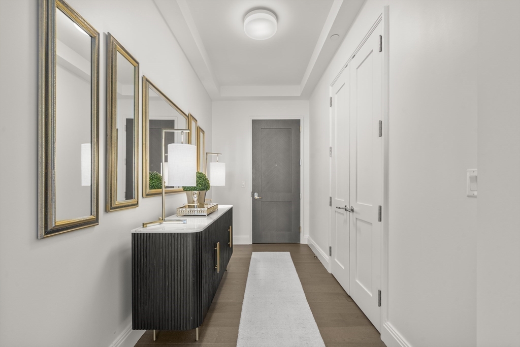 240 Devonshire Street, Unit 3701 Boston, MA 02110 - Photo 12 of 40 a bathroom with a double vanity sink a mirror and a bathtub