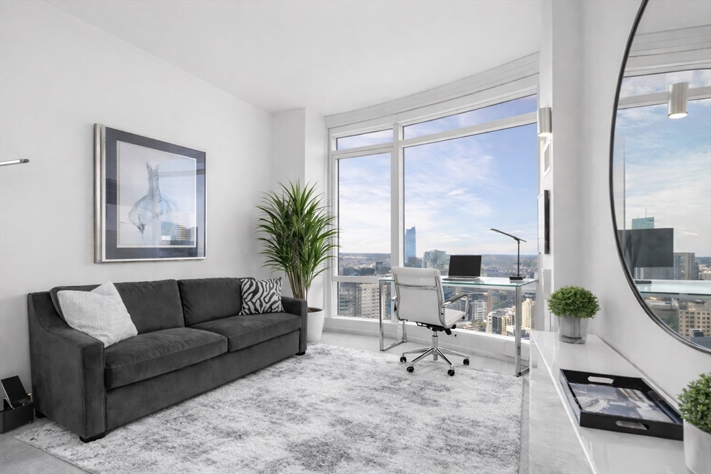 240 Devonshire Street, Unit 3701 Boston, MA 02110 - Photo 15 of 40 a living room with furniture and a large window