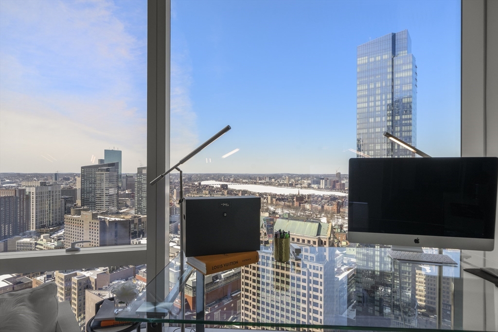 240 Devonshire Street, Unit 3701 Boston, MA 02110 - Photo 16 of 40 a outdoor living space with furniture and a flat screen tv