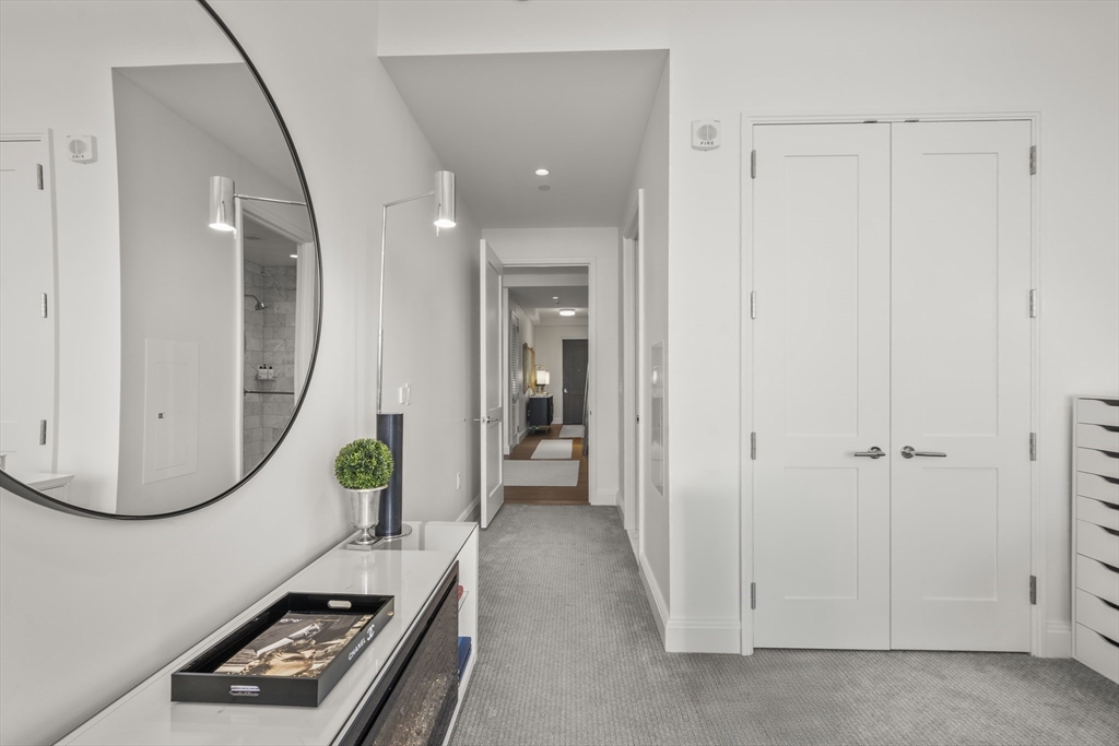 240 Devonshire Street, Unit 3701 Boston, MA 02110 - Photo 17 of 40 a view of a livingroom with wooden floor and a bathroom