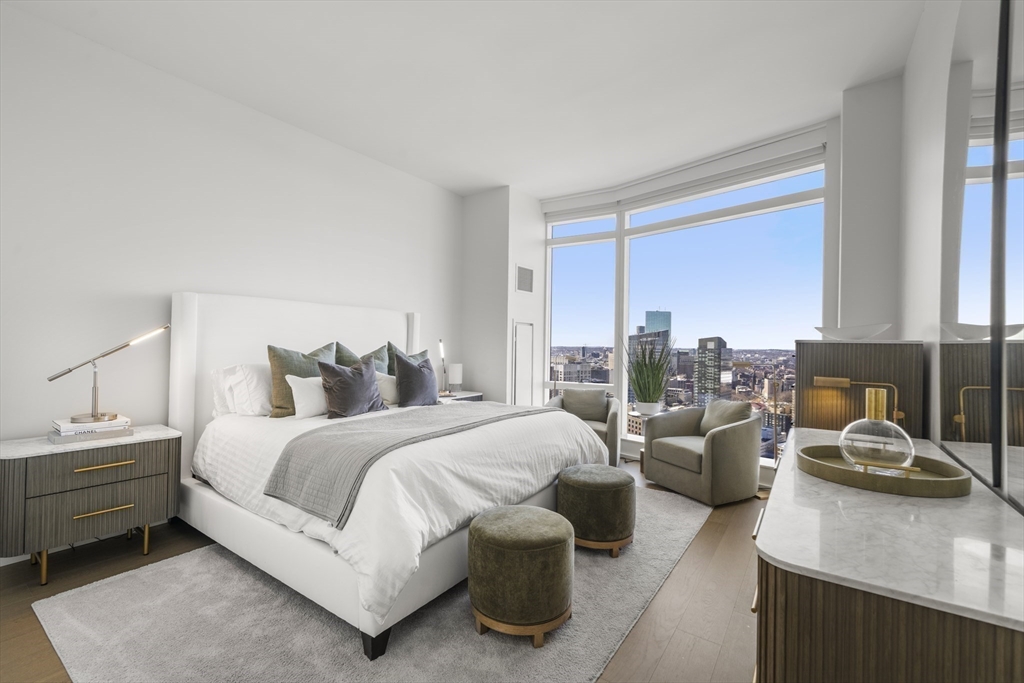240 Devonshire Street, Unit 3701 Boston, MA 02110 - Photo 20 of 40 a large bedroom with a bed and large window