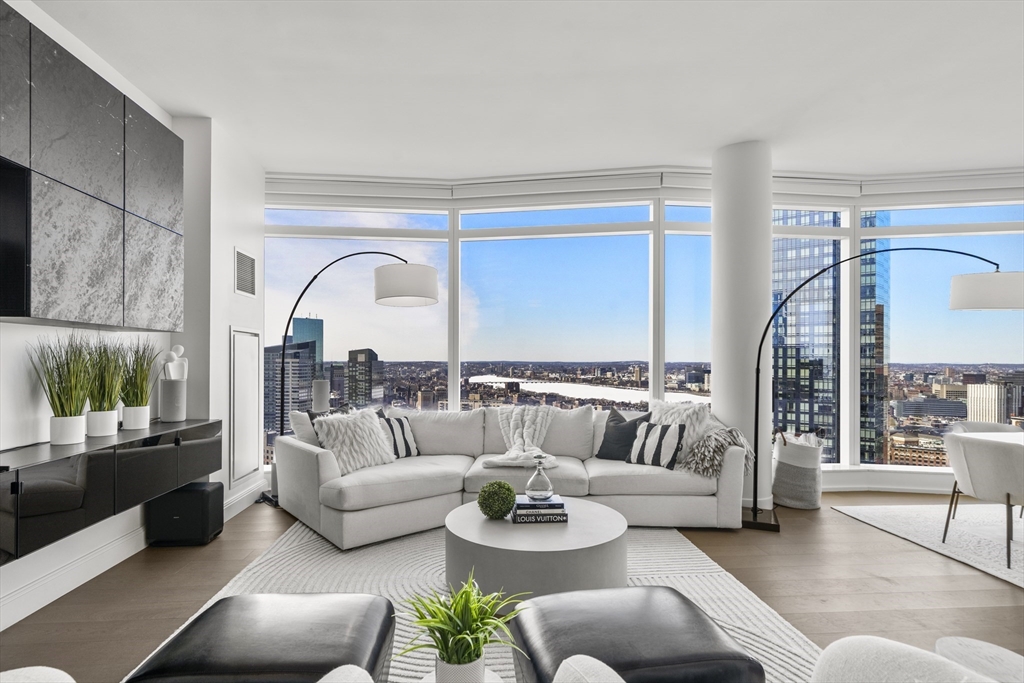 240 Devonshire Street, Unit 3701 Boston, MA 02110 - Photo 2 of 40 a living room with furniture and a large window
