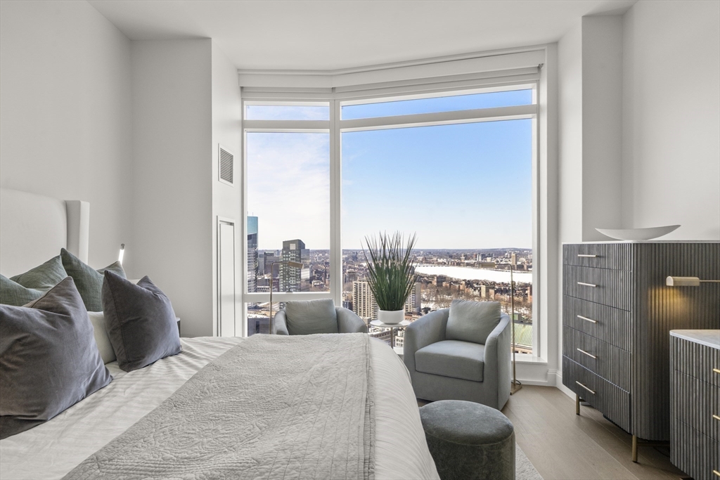 240 Devonshire Street, Unit 3701 Boston, MA 02110 - Photo 21 of 40 a bedroom with furniture and a large window