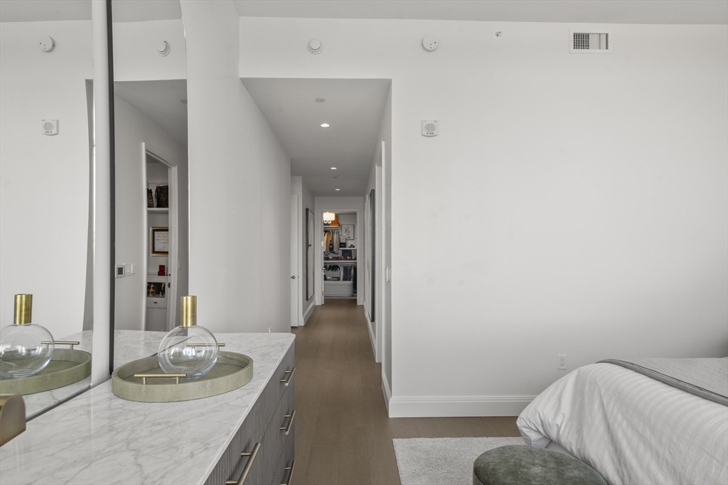 240 Devonshire Street, Unit 3701 Boston, MA 02110 - Photo 22 of 40 a living room with furniture and a wooden floor