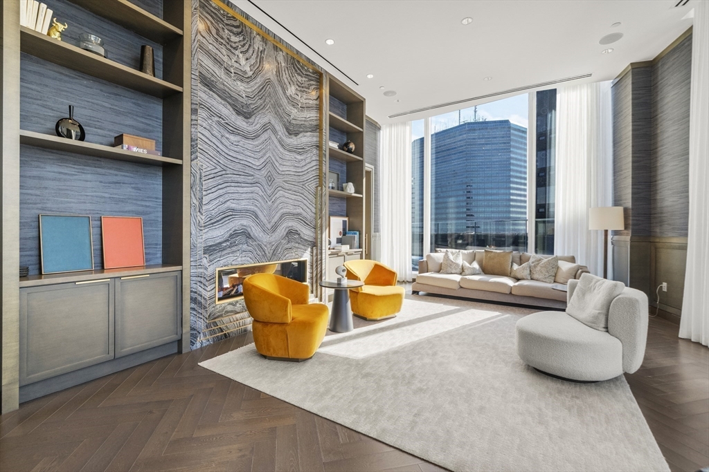 240 Devonshire Street, Unit 3701 Boston, MA 02110 - Photo 30 of 40 a living room with furniture and a potted plant
