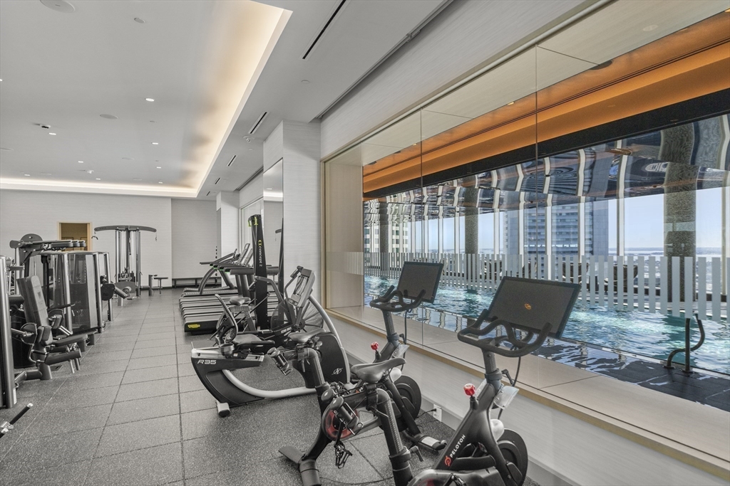 240 Devonshire Street, Unit 3701 Boston, MA 02110 - Photo 32 of 40 a room with gym equipment and large window