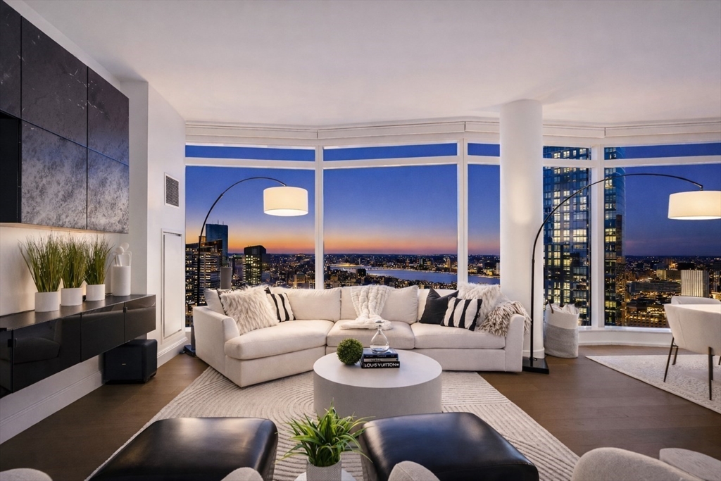 240 Devonshire Street, Unit 3701 Boston, MA 02110 - Photo 4 of 40 a living room with furniture and a flat screen tv