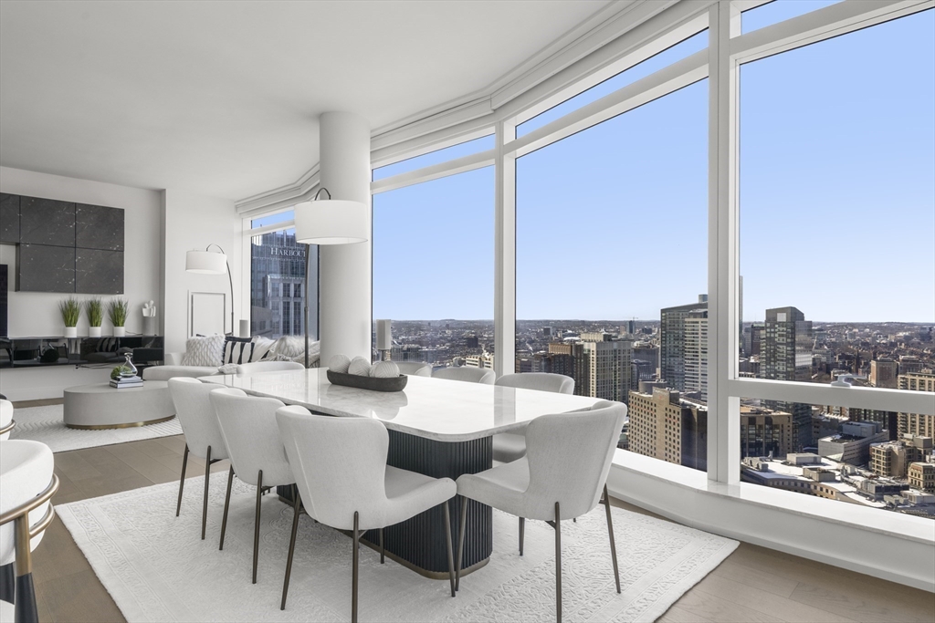 240 Devonshire Street, Unit 3701 Boston, MA 02110 - Photo 7 of 40 a dining room with furniture and a floor to ceiling window