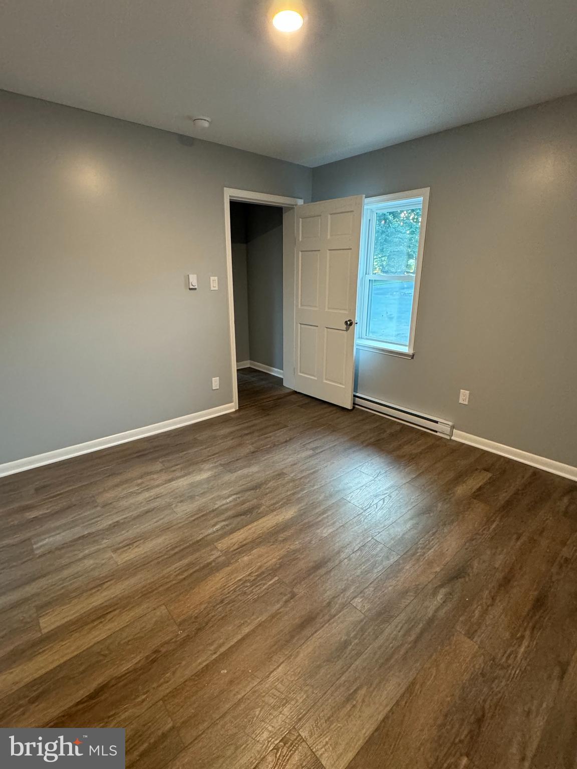 9947 Crossfield Road Hagerstown, MD 21740 - Photo 15 of 39 an empty room with wooden floor and windows