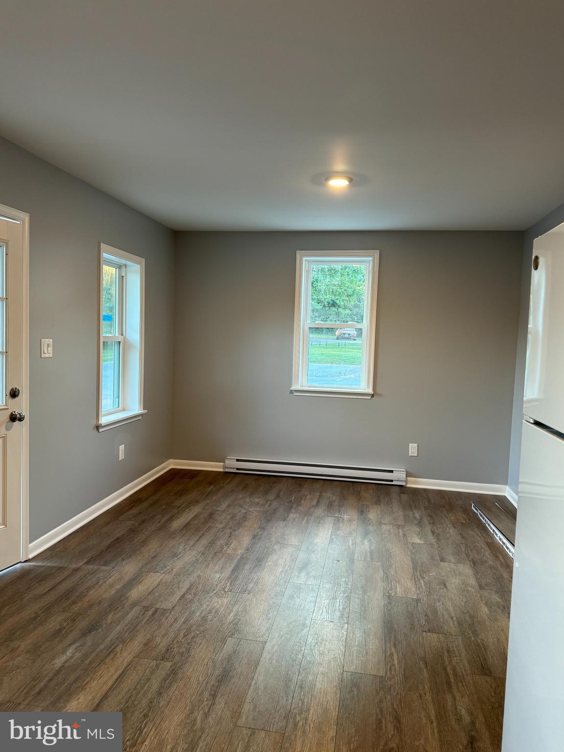 9947 Crossfield Road Hagerstown, MD 21740 - Photo 19 of 39 an empty room with wooden floor and windows