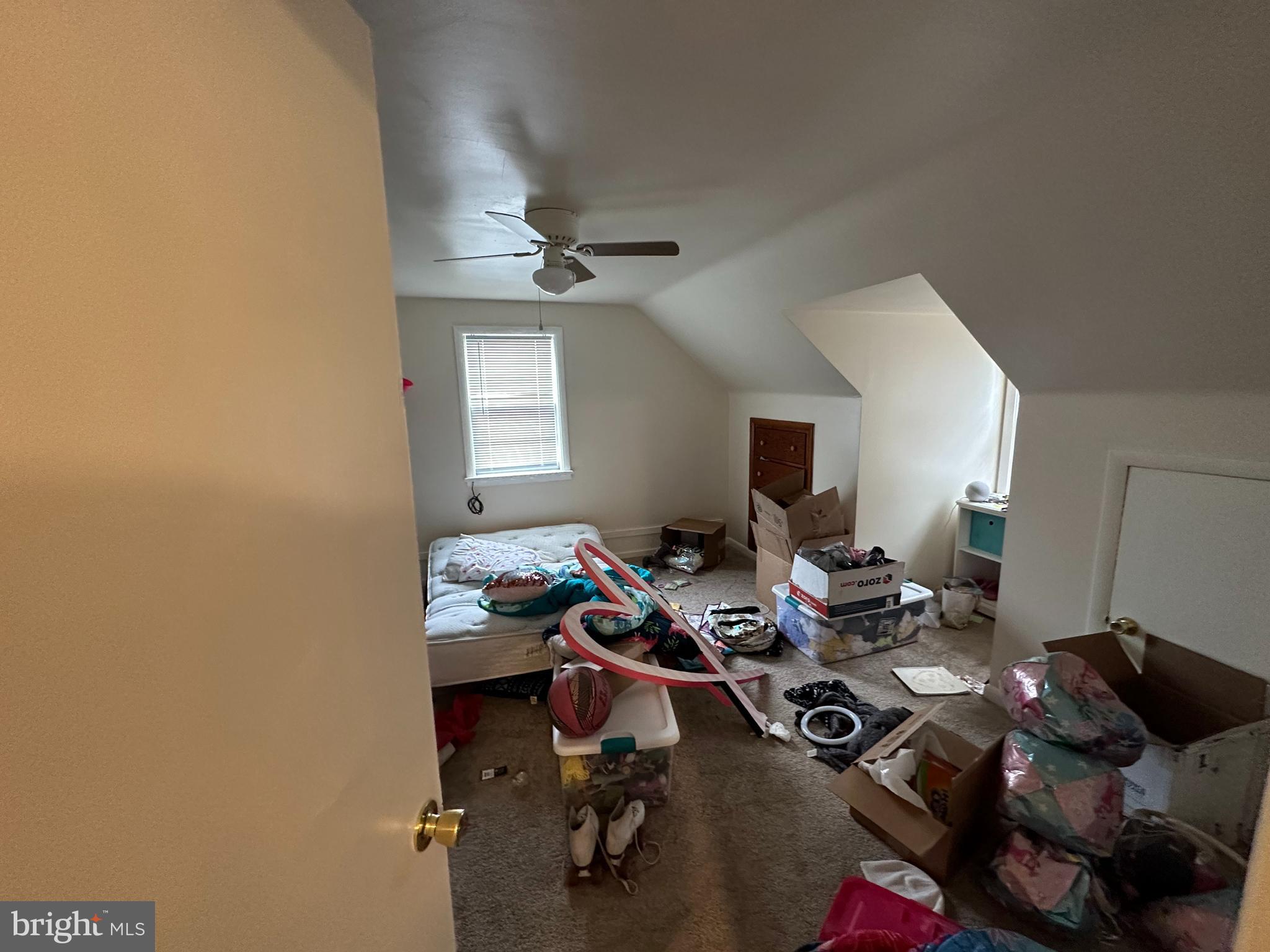 9947 Crossfield Road Hagerstown, MD 21740 - Photo 30 of 39 a living room with furniture a fireplace and a flat screen tv