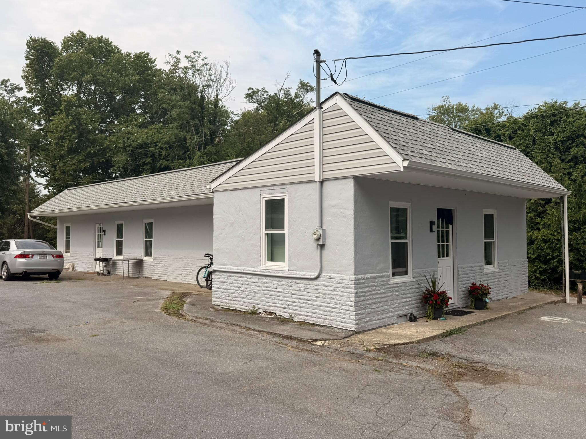 9947 Crossfield Road Hagerstown, MD 21740 - Photo 10 of 39 a view of a house with a patio and a yard
