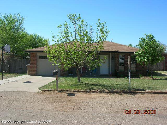 58 Hunsley Road Canyon, TX 79015 - Photo 1 of 10 a front view of a house with a yard and garage