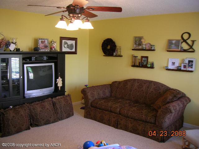 58 Hunsley Road Canyon, TX 79015 - Photo 2 of 10 a living room with furniture and a fireplace