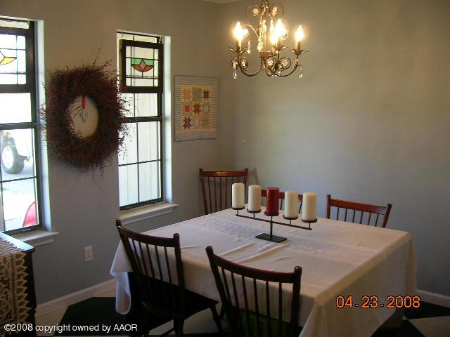 58 Hunsley Road Canyon, TX 79015 - Photo 4 of 10 a view of a dining room with furniture and chandelier
