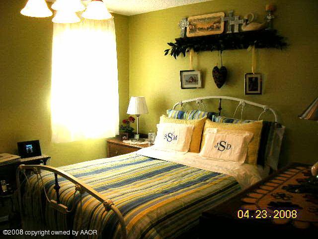 58 Hunsley Road Canyon, TX 79015 - Photo 5 of 10 a bedroom with a bed and teddy bear on bed