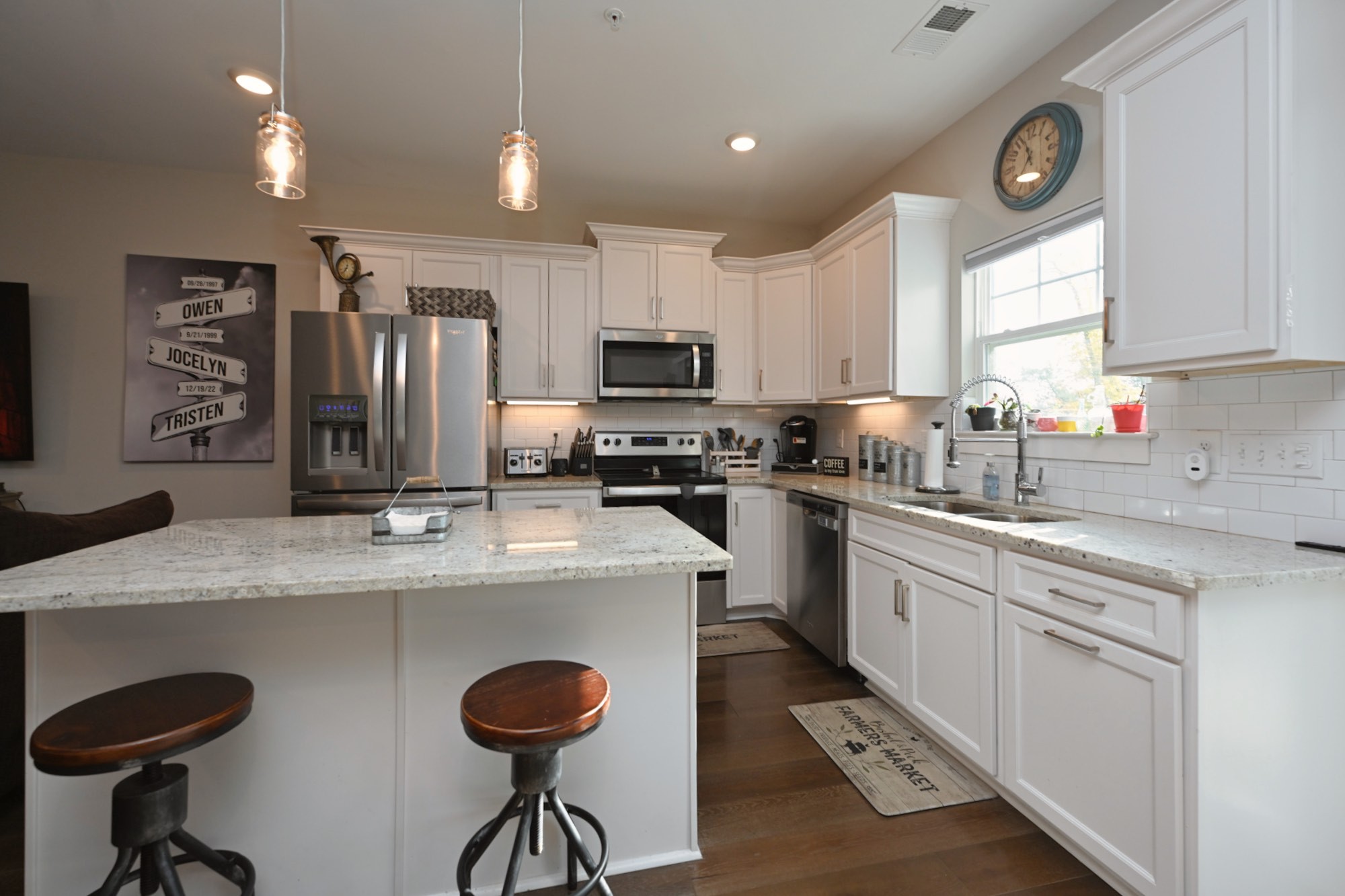 1144 Lock 4 Road, Unit J2 Gallatin, TN 37066 - Photo 14 of 28 a kitchen with granite countertop a sink stainless steel appliances and cabinets