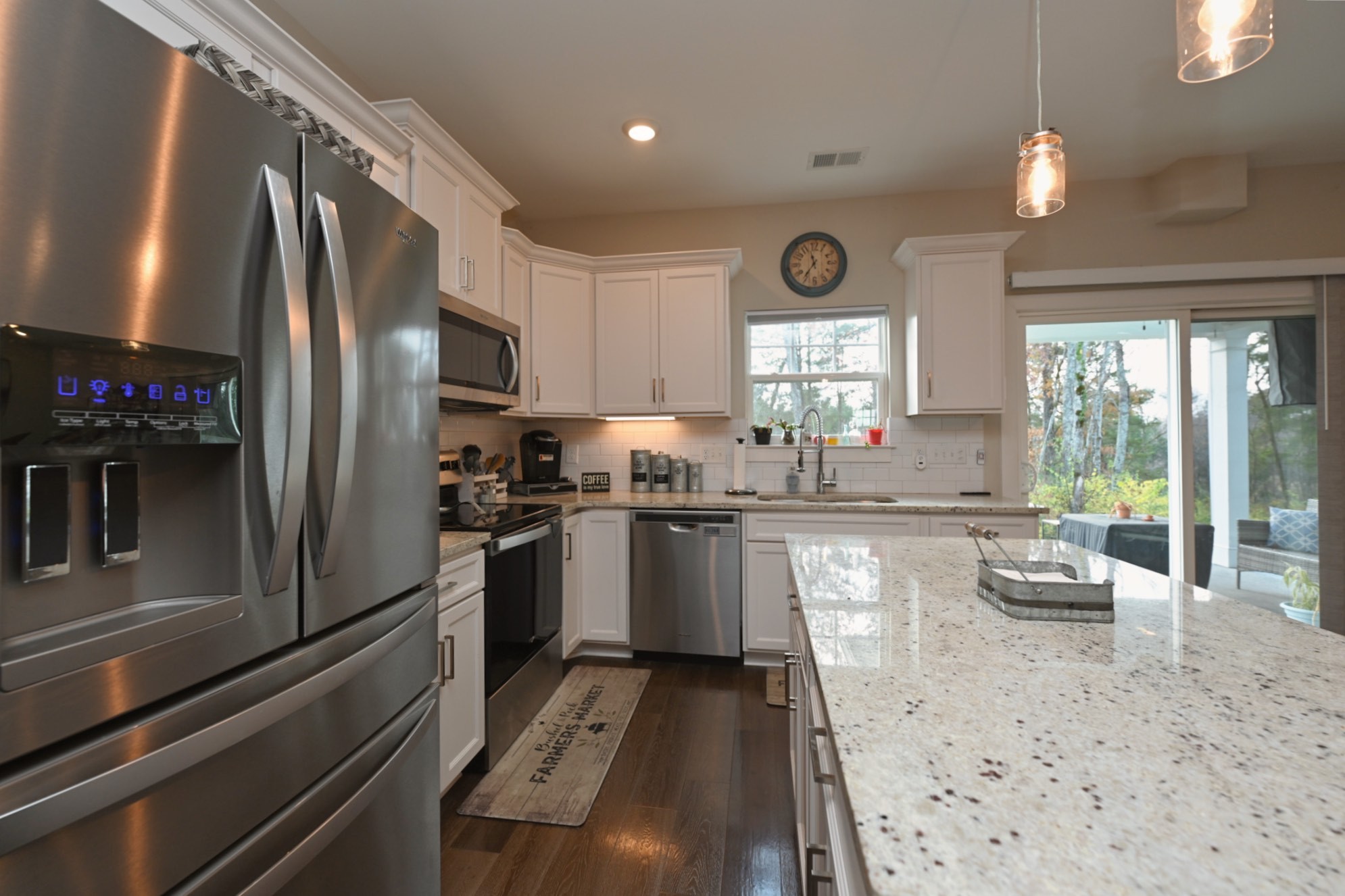 1144 Lock 4 Road, Unit J2 Gallatin, TN 37066 - Photo 16 of 28 a kitchen with granite countertop stainless steel appliances cabinets a sink and a large window