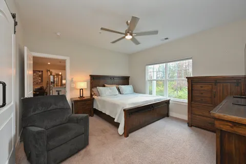 a bed room with a bed and a window