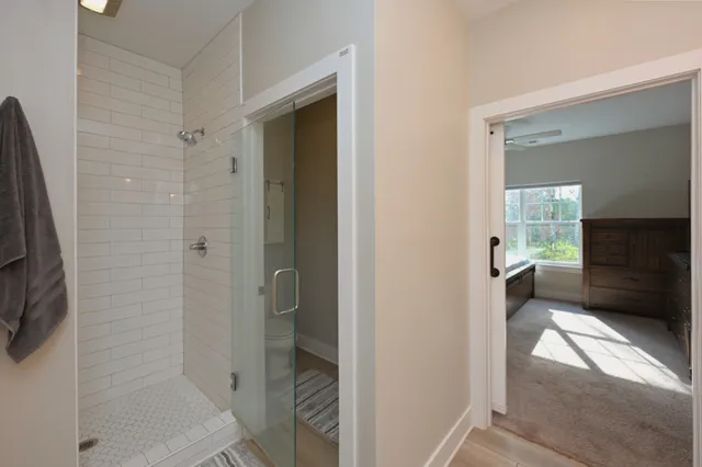 a bathroom with a glass shower door
