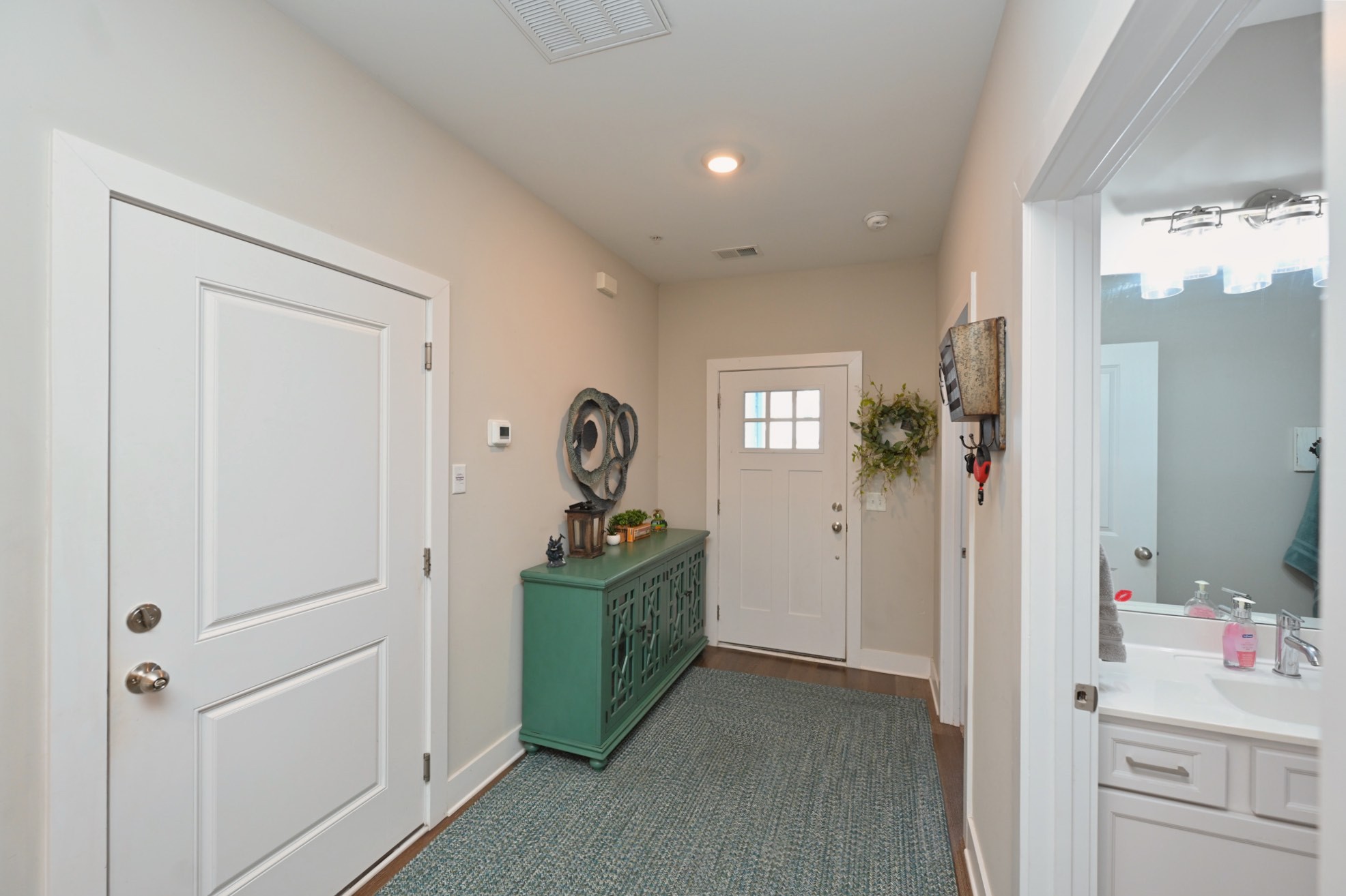 1144 Lock 4 Road, Unit J2 Gallatin, TN 37066 - Photo 7 of 28 a view of a hallway to a livingroom and a livingroom with furniture