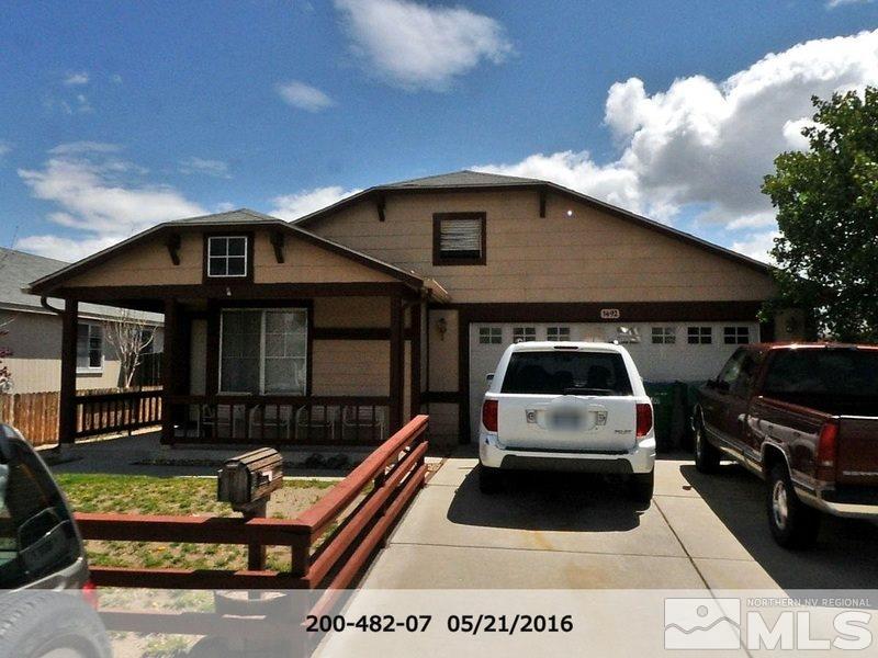 a front view of a house with parking space
