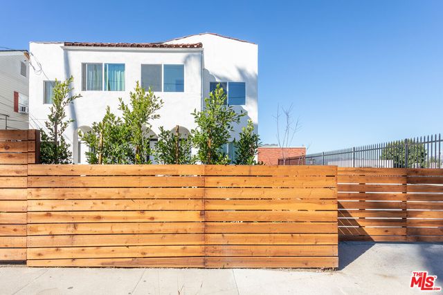 a view of a brick building with many windows