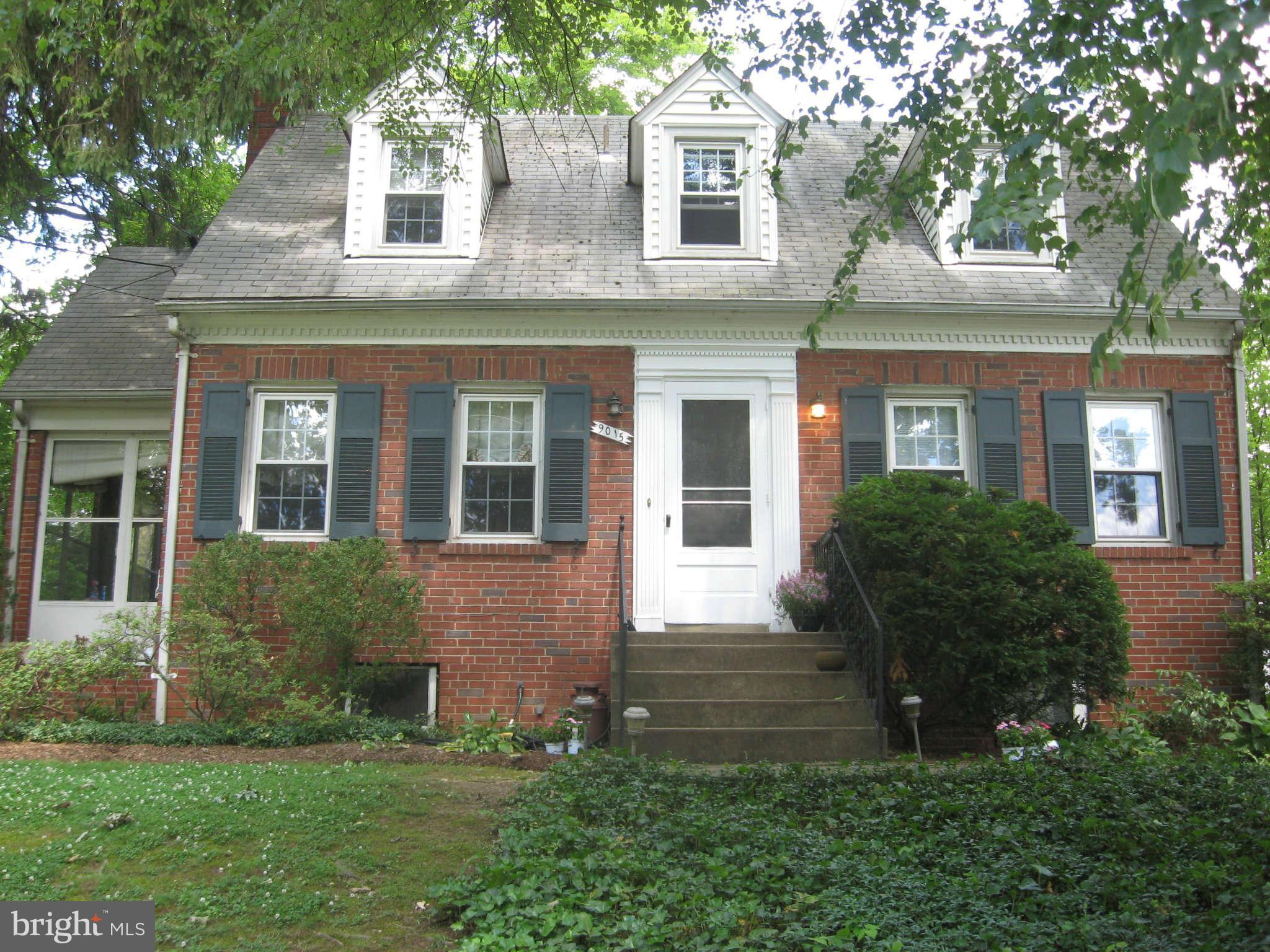 9015 Bradford Road Silver Spring, MD 20901 - Photo 1 of 25 front view of a house with a yard