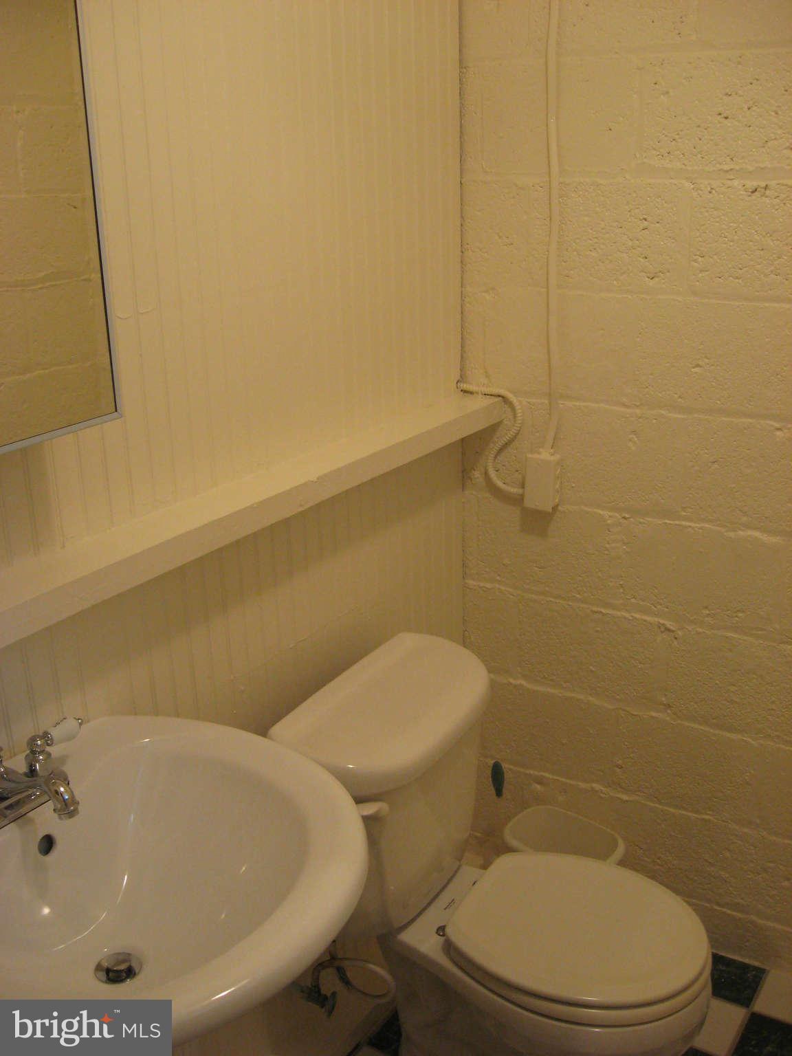 9015 Bradford Road Silver Spring, MD 20901 - Photo 20 of 25 a bathroom with a sink and a toilet