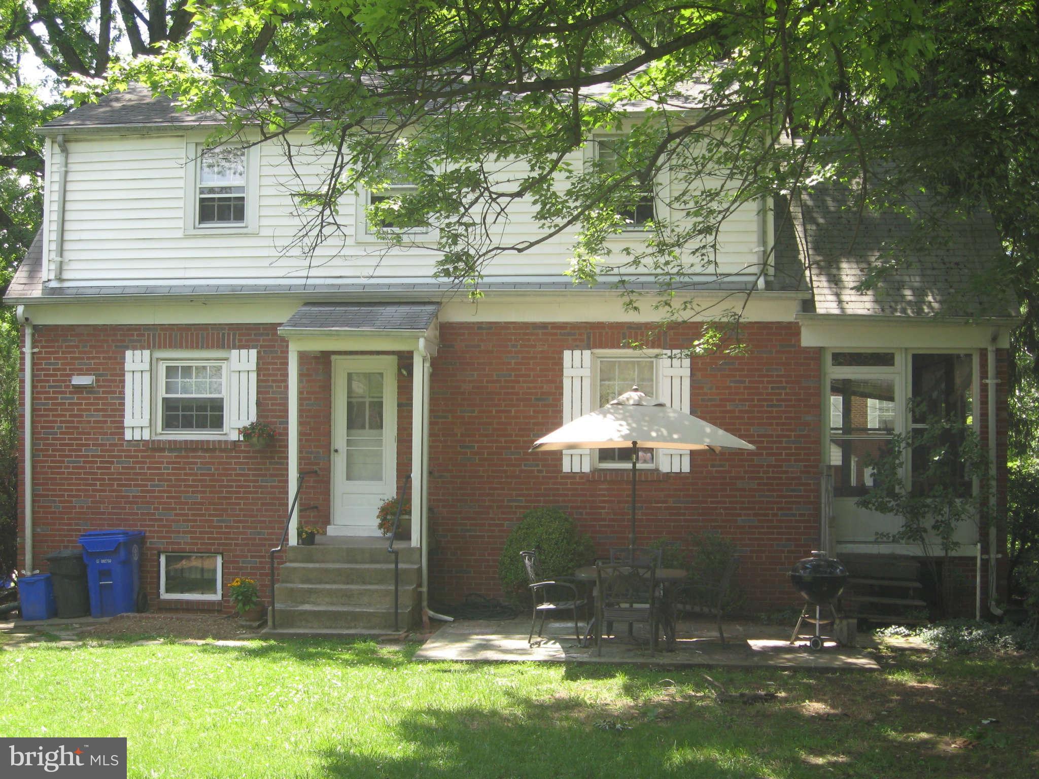 9015 Bradford Road Silver Spring, MD 20901 - Photo 23 of 25 a front view of a house with a yard