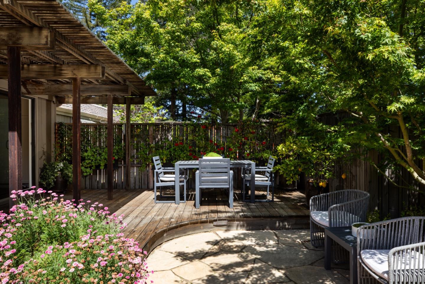 10 Farm Road Los Altos, CA 94024 - Photo 22 of 31 a view of a patio with table and chairs potted plants and large tree