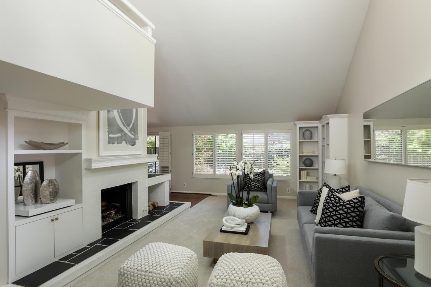 10 Farm Road Los Altos, CA 94024 - Photo 3 of 31 a living room with furniture a fireplace a large window and potted plants