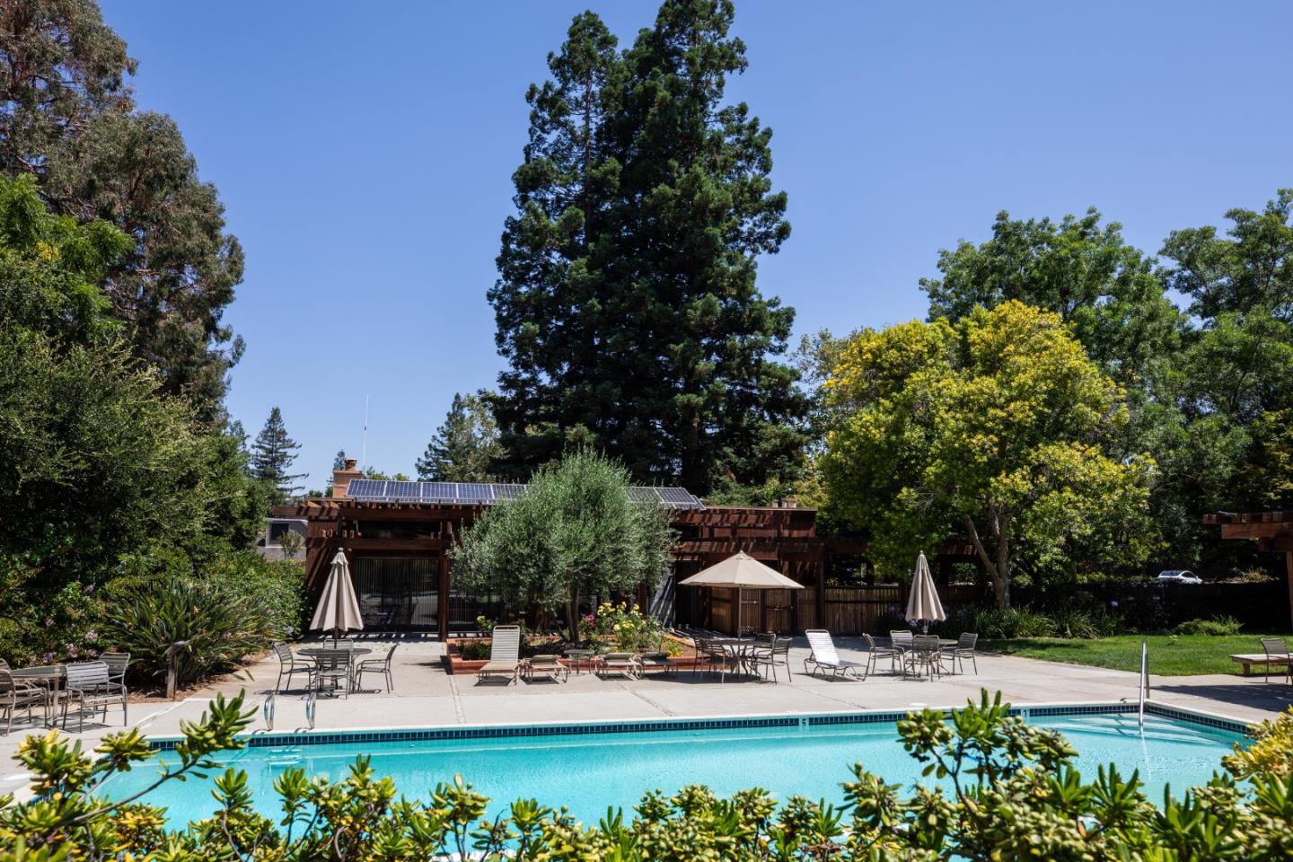 10 Farm Road Los Altos, CA 94024 - Photo 31 of 31 a view of the patio with couches and table and chairs under an umbrella