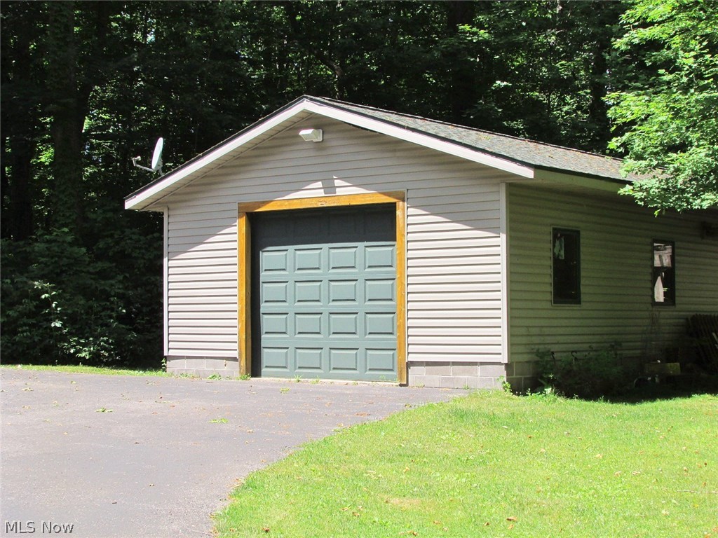 6840 Williams Road Painesville, OH 44077 - Photo 30 of 34 Outside is an additional garage that can house 2 cars (tandem). It has electric and a cement floor.