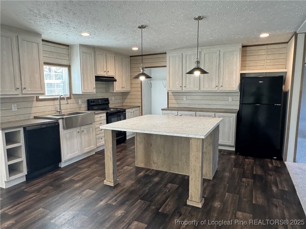 280 Cain Road St. Pauls, NC 28384 - Photo 14 of 23 a kitchen with kitchen island a sink stove and refrigerator