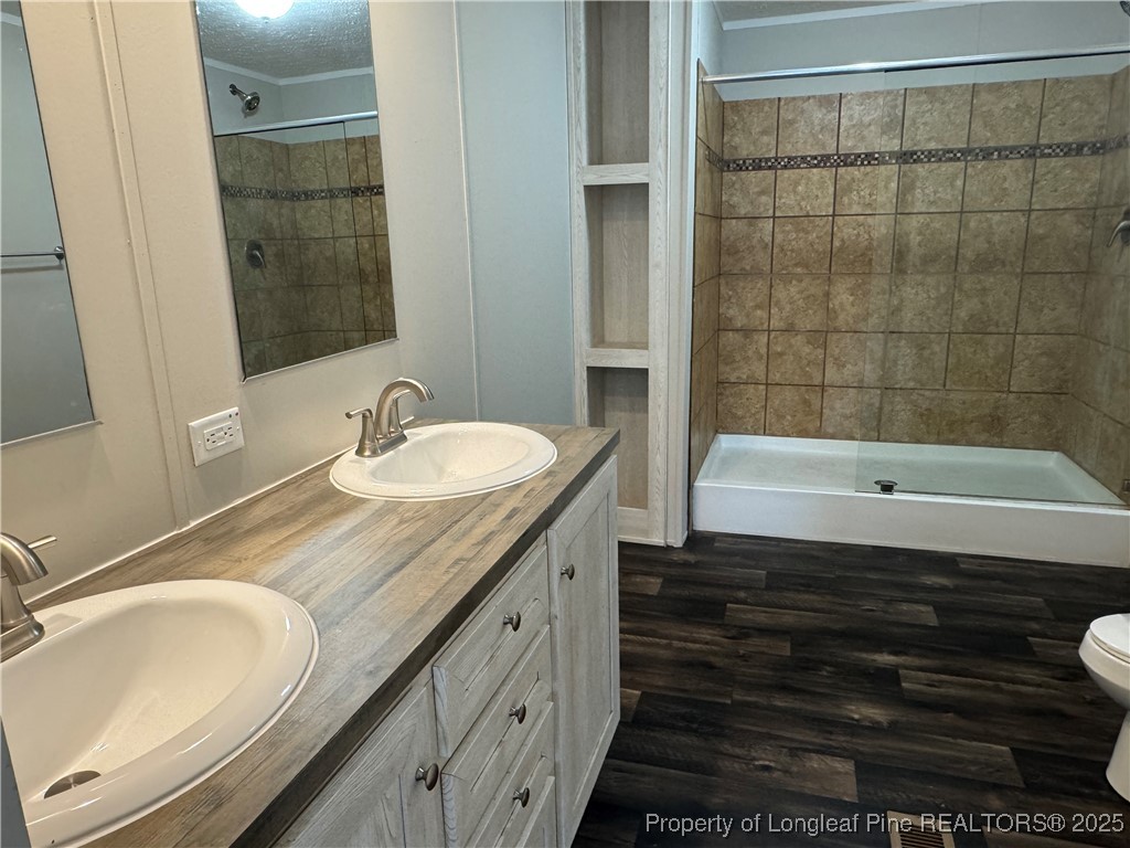 280 Cain Road St. Pauls, NC 28384 - Photo 16 of 23 a bathroom with a granite countertop sink and a bathtub