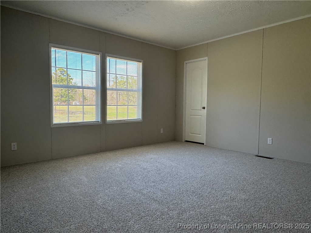 280 Cain Road St. Pauls, NC 28384 - Photo 19 of 23 an empty room with a window
