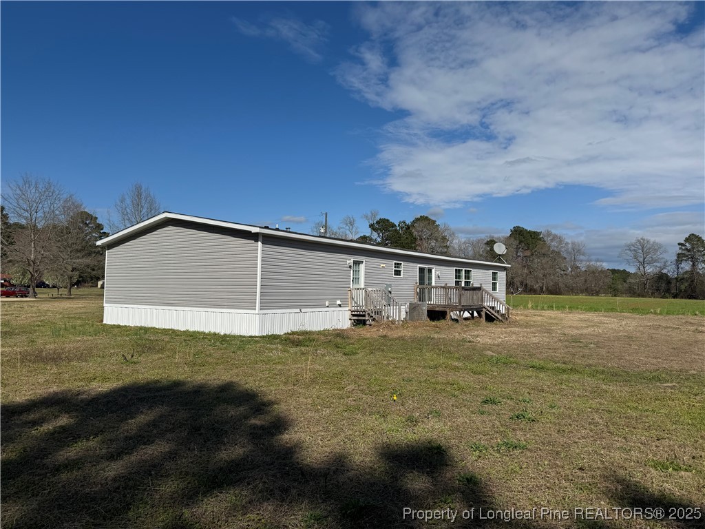 280 Cain Road St. Pauls, NC 28384 - Photo 5 of 23 a view of a house with a big yard