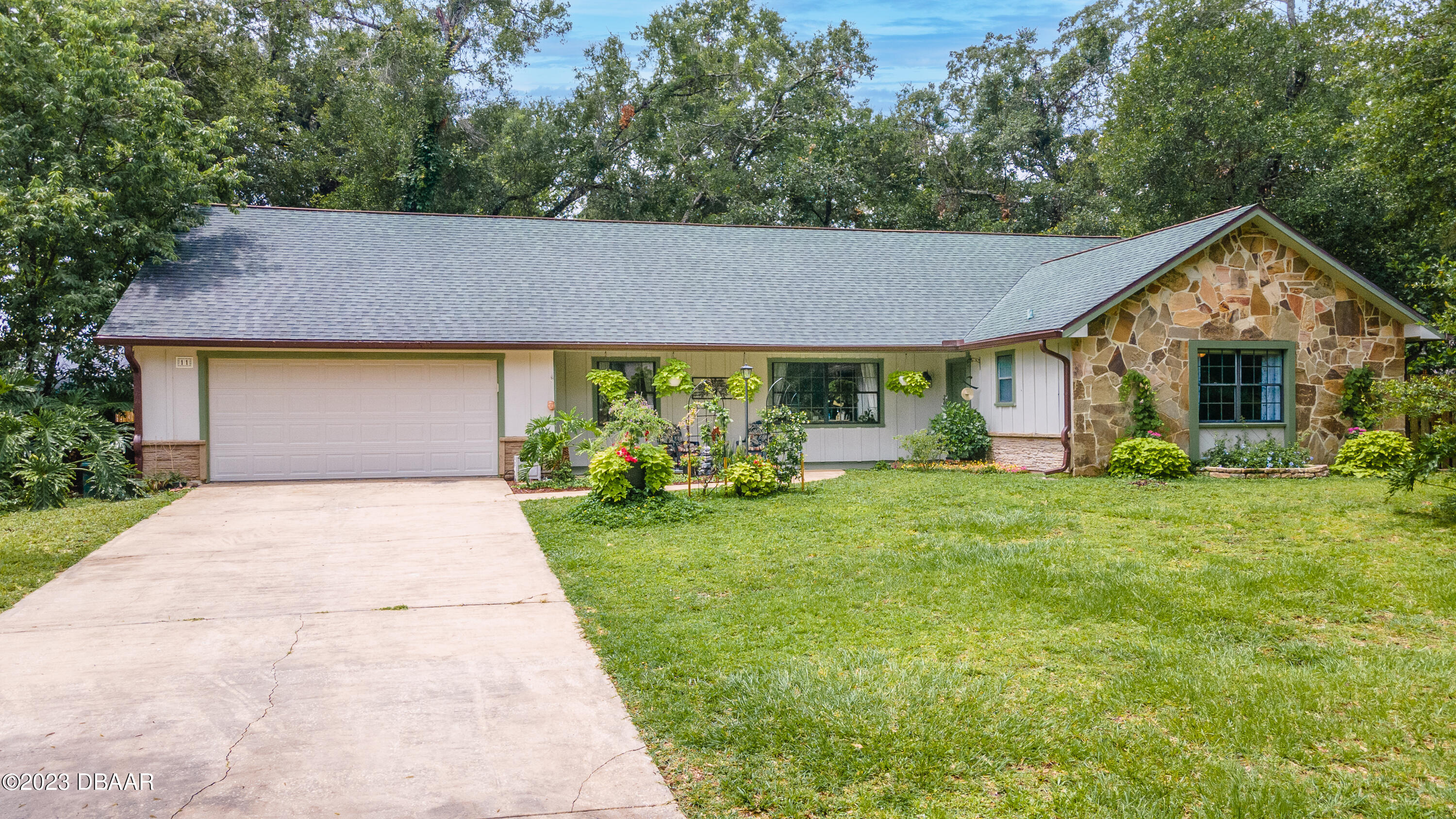 11 Eagle Drive Ormond Beach, FL 32174 - Photo 1 of 25 a front view of house with yard and green space