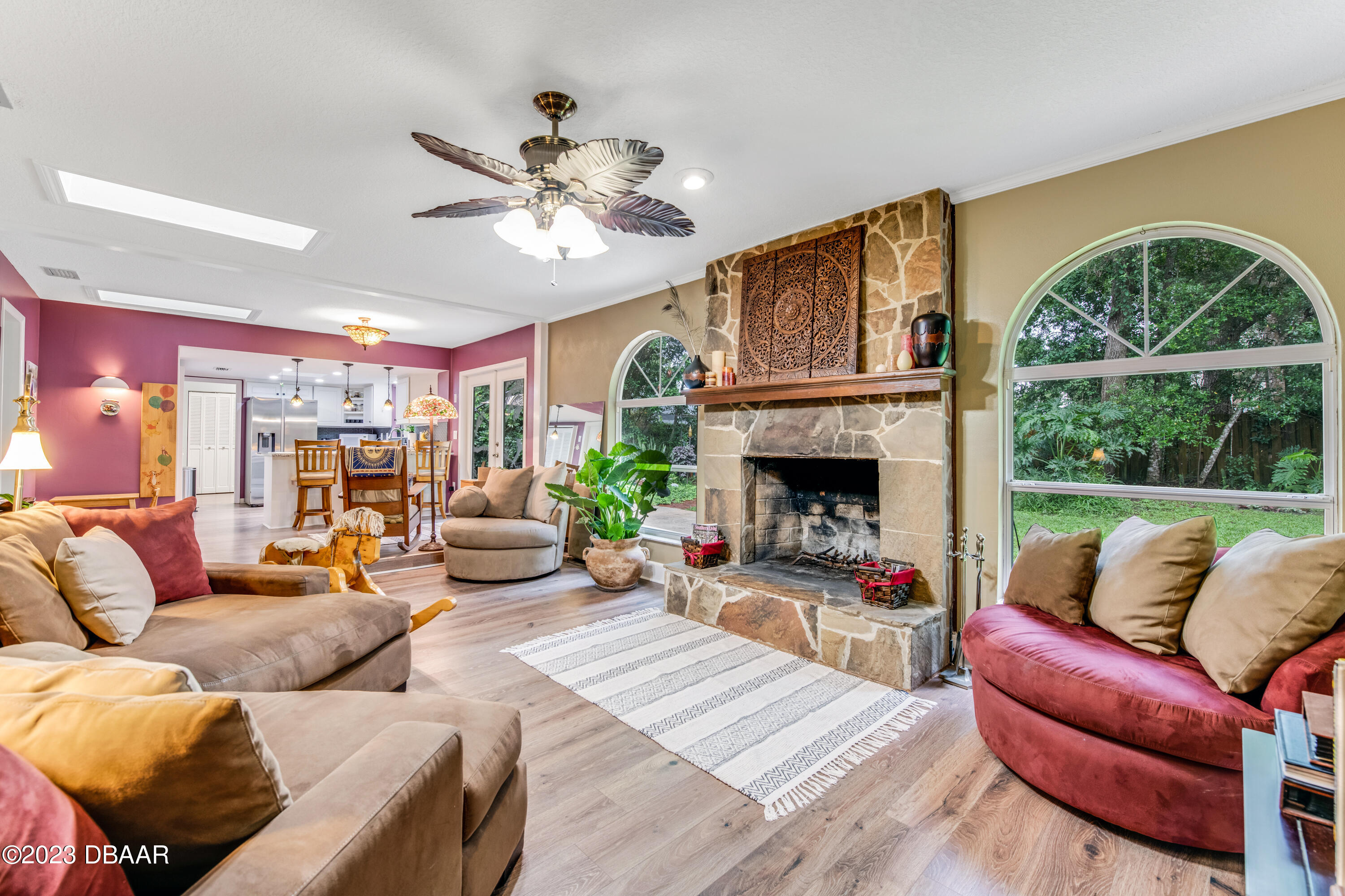 11 Eagle Drive Ormond Beach, FL 32174 - Photo 13 of 25 a living room with furniture a fireplace and a large window
