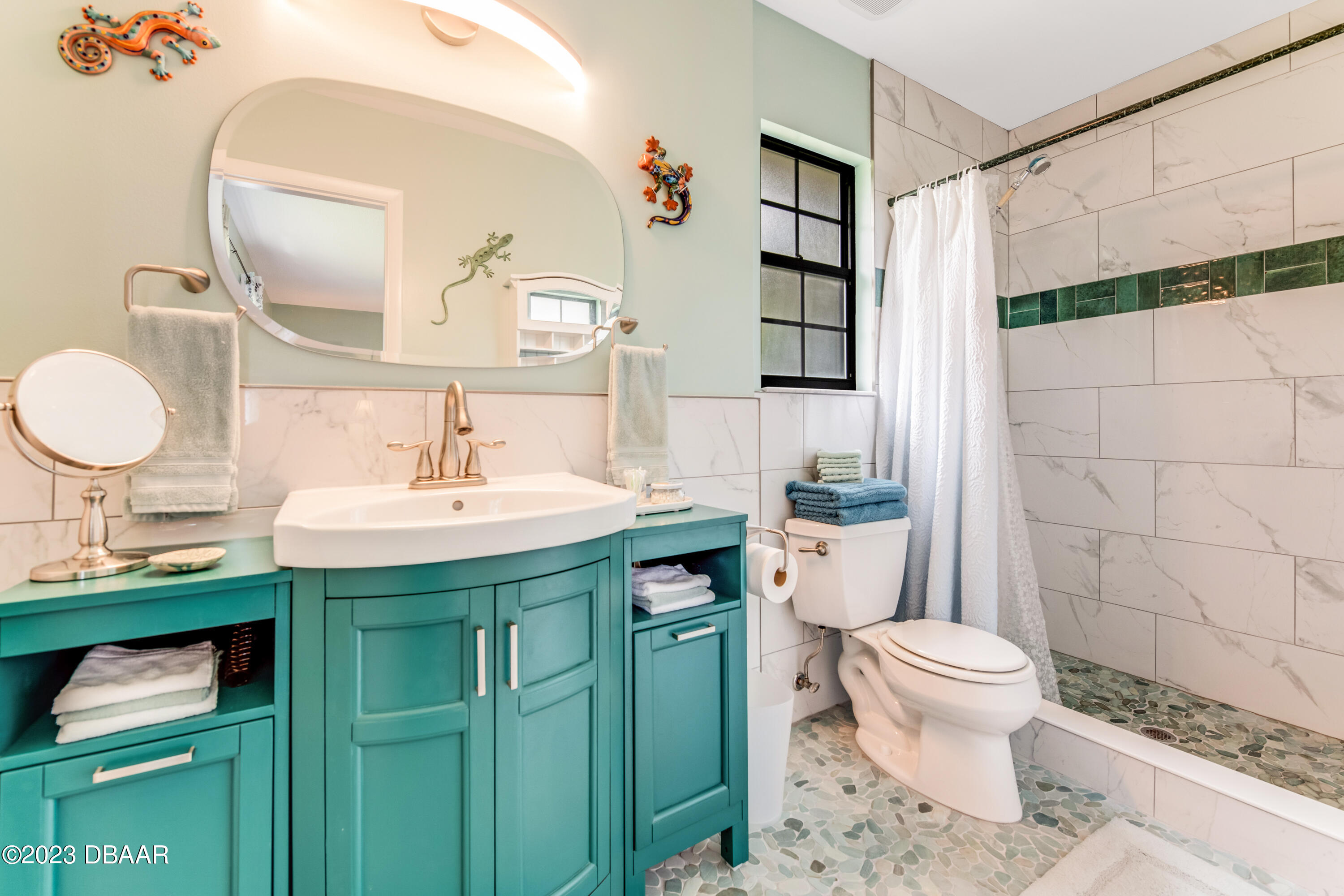 11 Eagle Drive Ormond Beach, FL 32174 - Photo 15 of 25 a bathroom with a sink toilet and shower