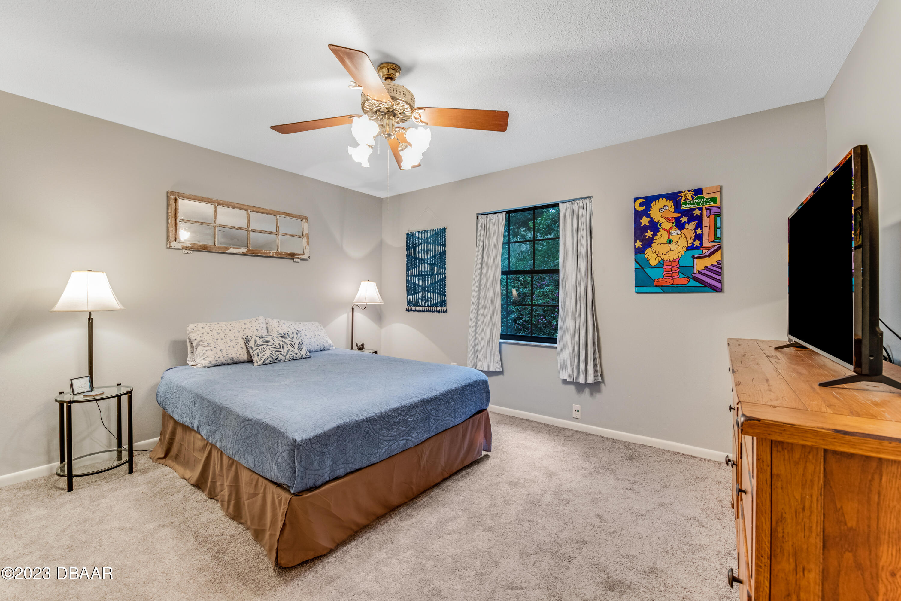 11 Eagle Drive Ormond Beach, FL 32174 - Photo 17 of 25 a bedroom with a bed and a flat screen tv