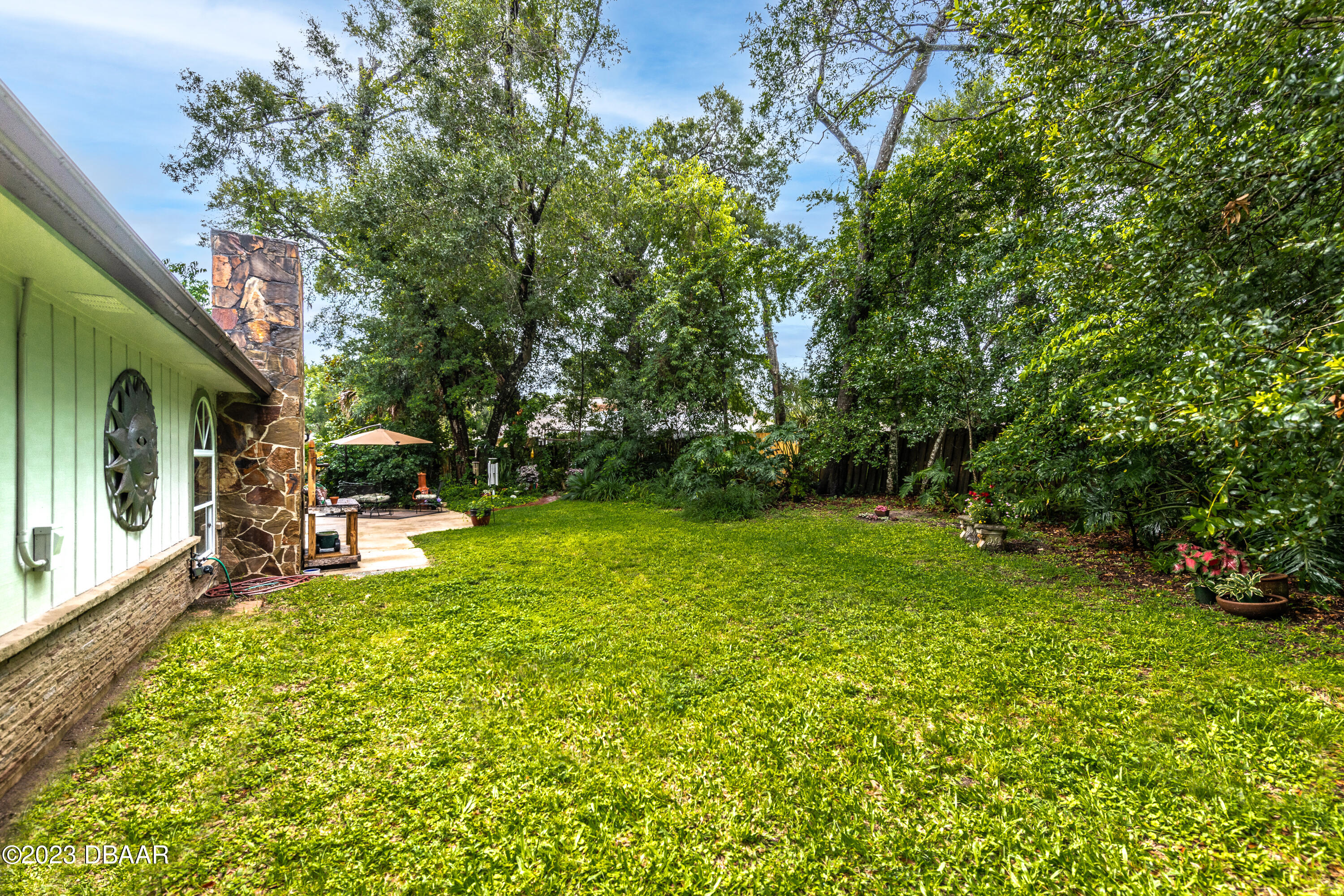 11 Eagle Drive Ormond Beach, FL 32174 - Photo 22 of 25 a view of backyard with swimming pool