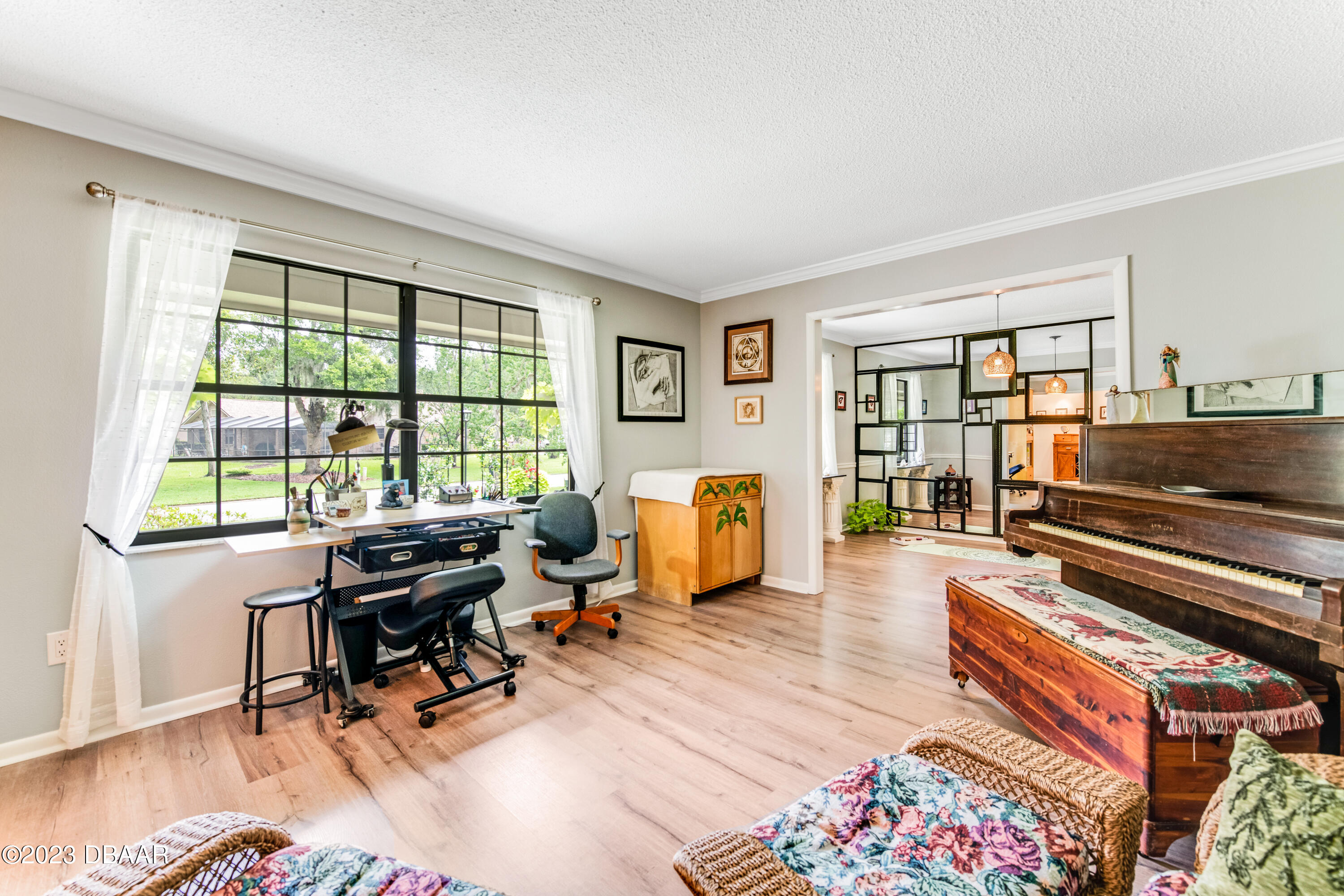 11 Eagle Drive Ormond Beach, FL 32174 - Photo 9 of 25 a living room with furniture a rug and a window