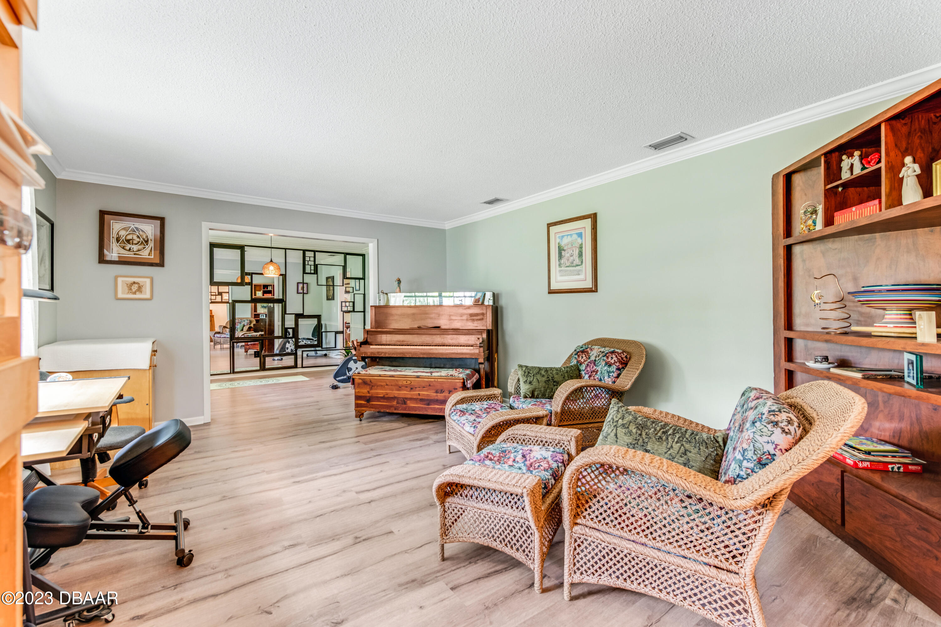 11 Eagle Drive Ormond Beach, FL 32174 - Photo 10 of 25 a living room with furniture gym equipment and a window