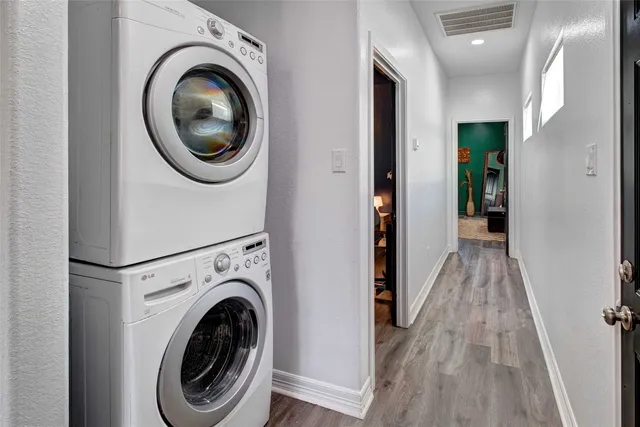 a view of a hallway with washer and dryer