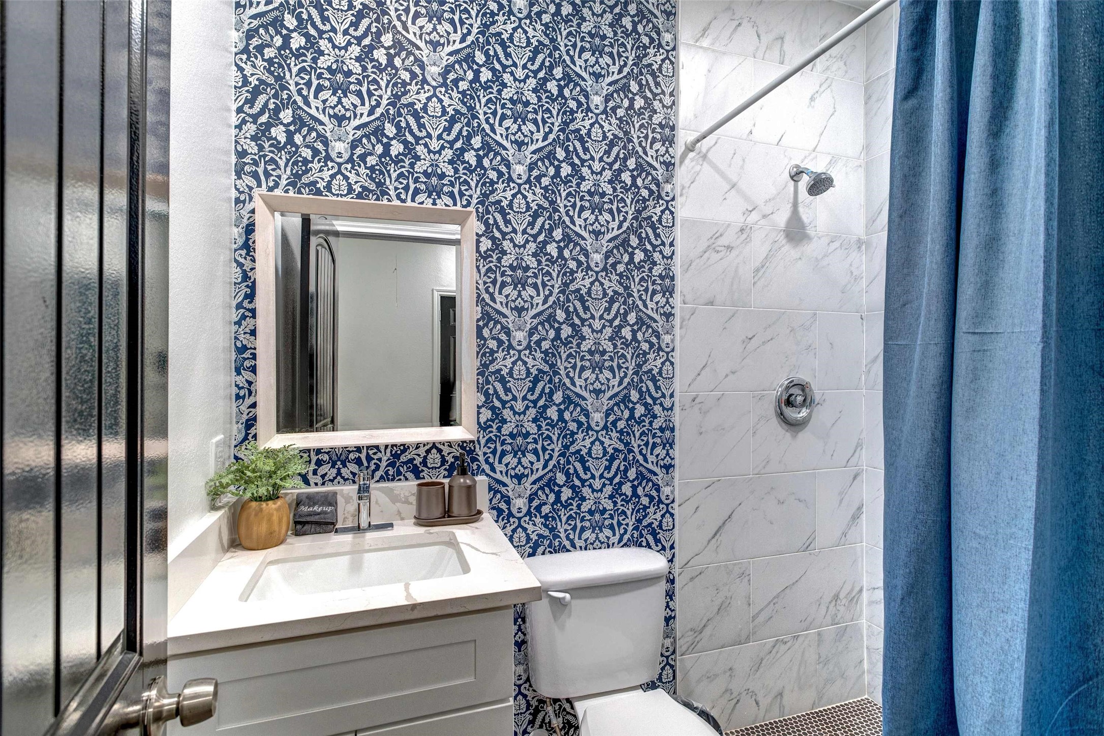 9816 Masterson Street Houston, TX 77029 - Photo 18 of 23 a bathroom with a toilet and a sink