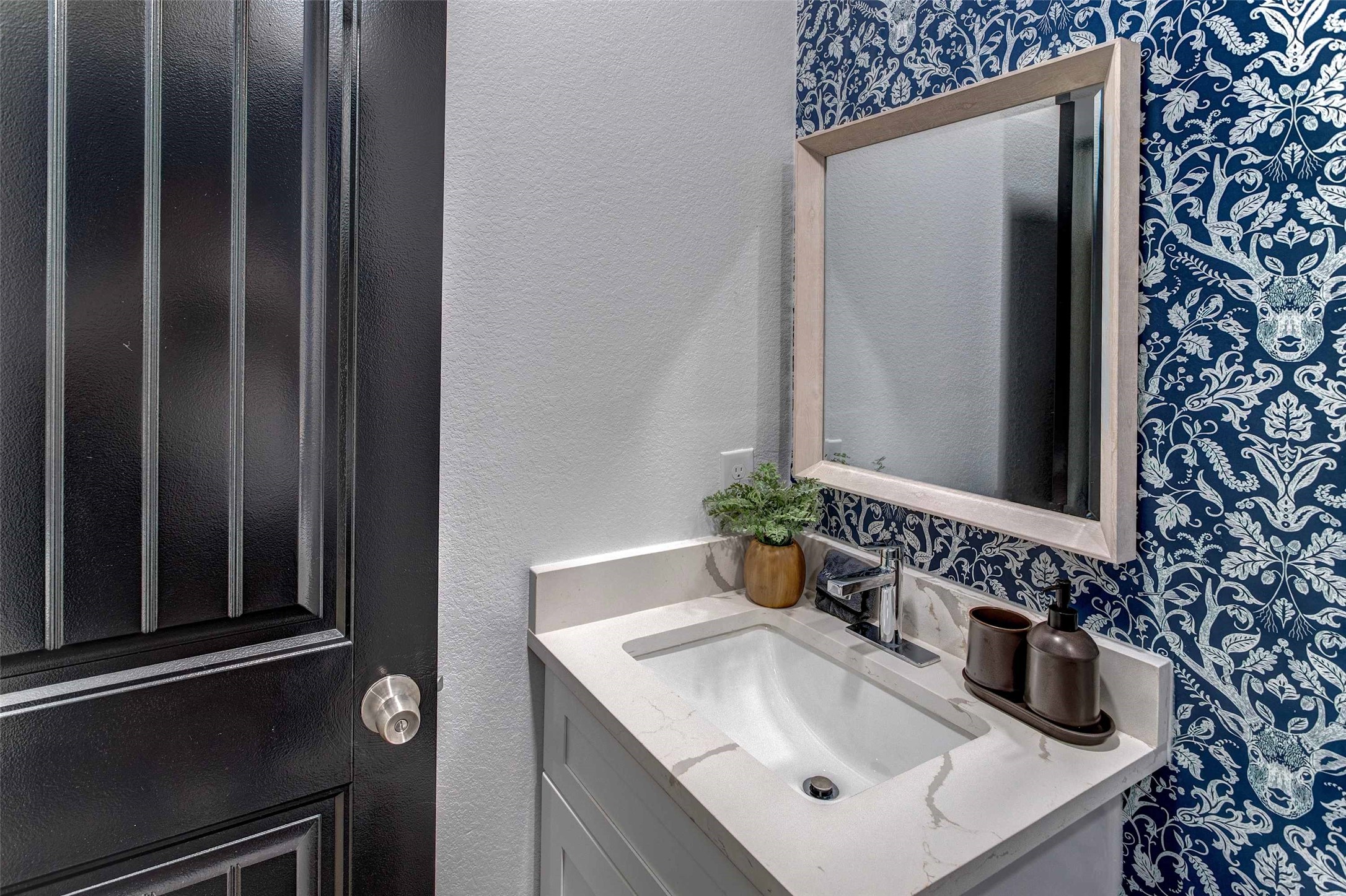 9816 Masterson Street Houston, TX 77029 - Photo 19 of 23 a bathroom with a sink and a mirror